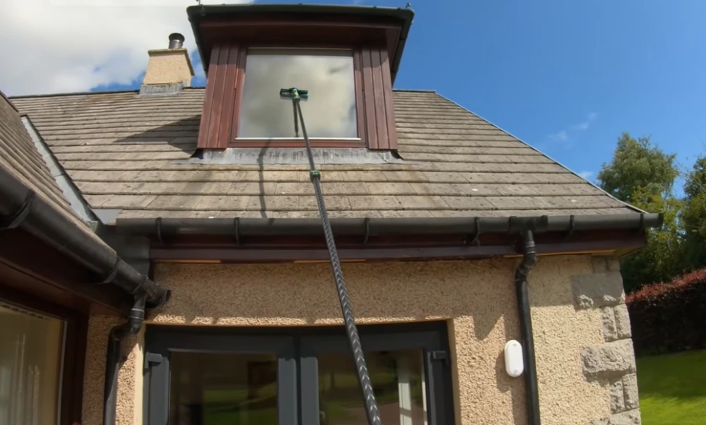 Coastal gutter cleaning β palm frond and leaf debris removed