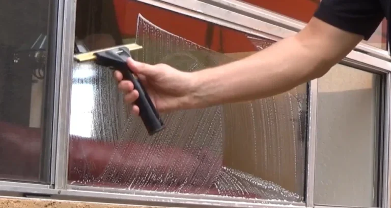 Window cleaner San Clemente CA removing salt film and hard water deposits from residential windows